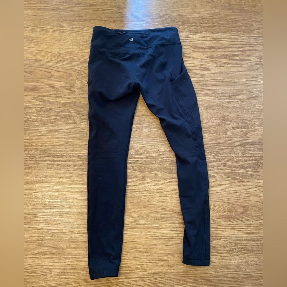 Black lululemon leggings with side pocket. Size 6